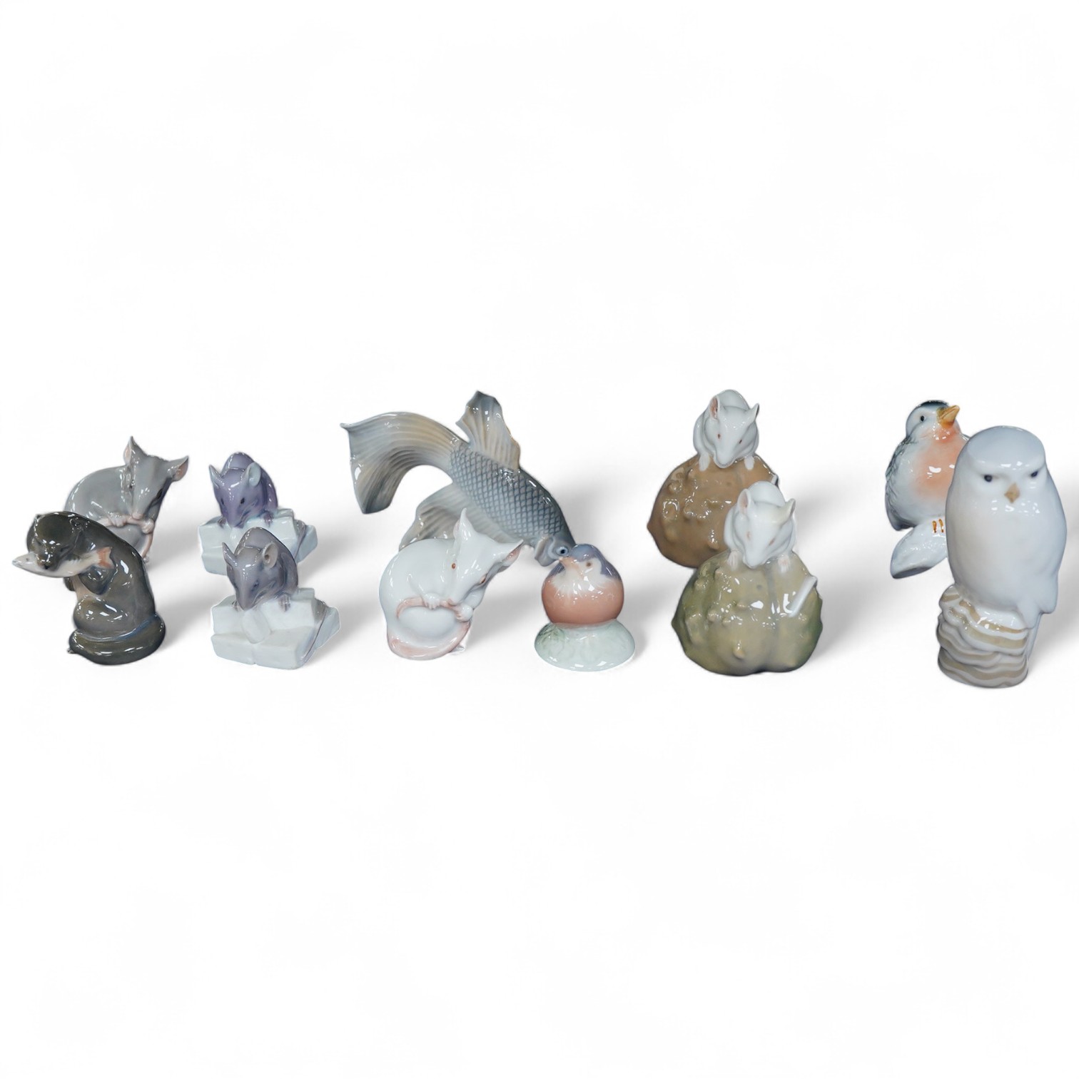 A collection of Royal Copenhagen figures of mice, birds and two other figures